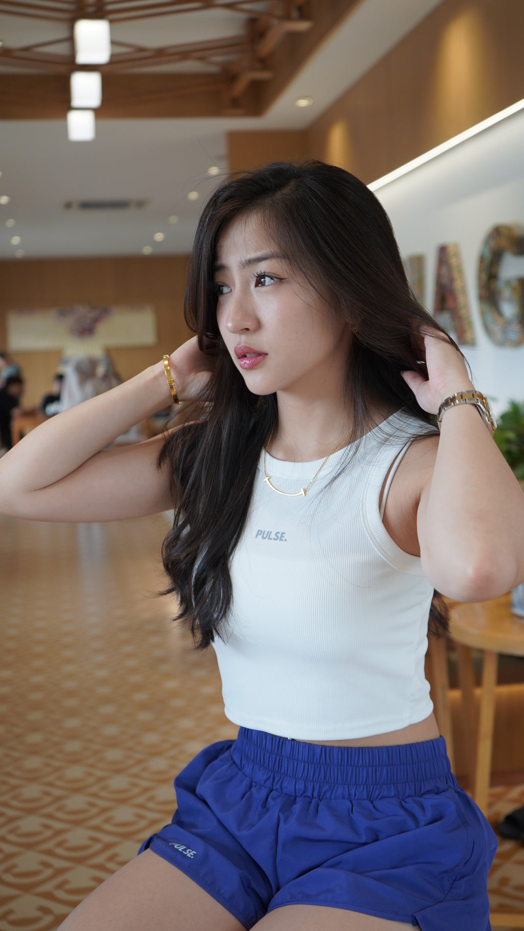 PULSE. All-Days Women's Shorts in Blue with a white crop top